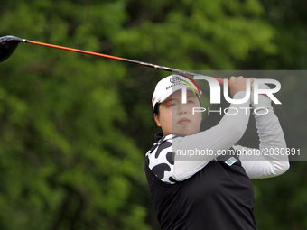 Shanshan Feng of China follows her shot from the 8th tee during the final round of the Meijer LPGA Classic golf tournament at Blythefield Co...