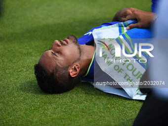 Nick Kyrgios (AUS) lays on the lawn for a medical treatment in the first round of AEGON Championships at Queen's Club, London, on June 18, 2...