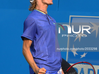 Denis Shapovalov (CAN) beats Kyle Edmund GBR)  during Round One match on the first day of the ATP Aegon Championships at the Queen's Club in...