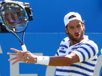 Feliciano Lopez  (ESP)   against Stan Wawrinka  (SUI)  during Round One match on the second day of the ATP Aegon Championships at the Queen'...