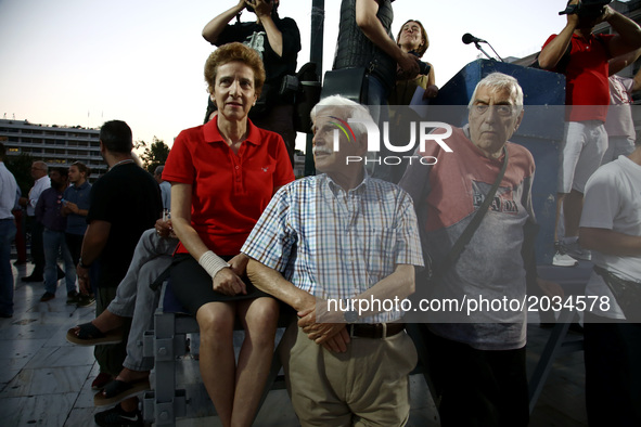 People take part to a rally organized by the Paraitithite (Resign) movement, at Syntagma Square, central Athens calling for the governments...
