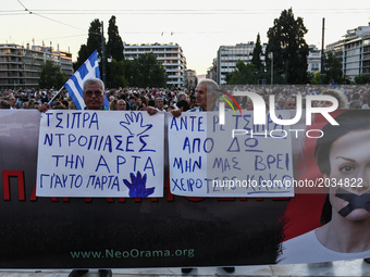 Greeks attending an anti government rally organized by the mostly conservative “Resign” movement at Syntagma Square, central Athens on June...