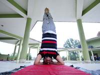 A yoga enthusiast youth performing Yoga Position during the celebration of International Day of Yoga organized by Yog Sadhana Samaj at Kirti...