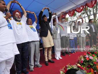 Ambassador of India to Nepal, Manjeev Singh Puri, Prime Minister of Nepal, Sher Bahadur Deuba along with VIPs performing Yoga Position durin...