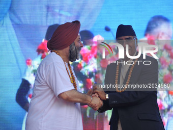Ambassador of India to Nepal, Manjeev Singh Puri and Prime Minister of Nepal, Sher Bahadur Deuba hand shake after the celebration of Interna...
