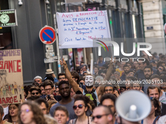 Protesters rally during a protest march in Lyon on June 19, 2017 to protest against Emmanuel Macron and executive orders, the march was call...