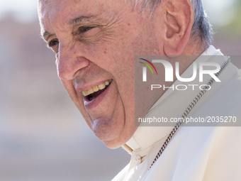 Pope Francis smiles as he arrives at the end of his Weekly General Audience in St. Peter's Square in Vatican City, Vatican on June 14, 2017....