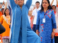 Rajasthan Chief Minister Vasundhara Raje with other participants take part in a yoga session during the 3rd International Yoga Day at SMS st...