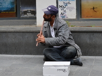 A musician plays flute during his performance on the street on World Music Day in Ankara, Turkey on June 21, 2017. World Music Day, also kno...