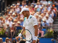 Gilles Muller (LUX) plays against Jo-Wilfried Tsonga (FRA) in the second round of AEGON Championships at Queen's Club, London, on June 21, 2...