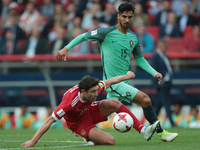 Yury Zhirkov (L) of the Russian national football team and André Gomes of the Portugal national football team vie for the ball during the 20...