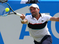 Julien Benneteau (FRA)   against Grigor Dimitrov BUL against during Round Two match on the third day of the ATP Aegon Championships at the Q...