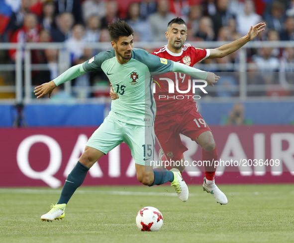 Alexander Samedov (R) of Russia national team and Andre Gomes of Portugal national team vie for the ball during the Group A - FIFA Confedera...