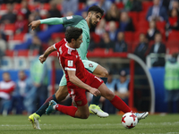 Yury Zhirkov (L) of Russia national team and Andre Gomes of Portugal national team vie for the ball during the Group A - FIFA Confederations...