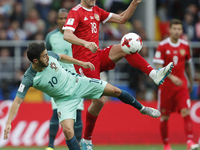 Yury Zhirkov (R) of Russia national team and Bernardo Silva of Portugal national team vie for the ball during the Group A - FIFA Confederati...