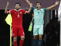 Georgy Dzhikya (L) of Russia national team and Andre Silva of Portugal national team react during the Group A - FIFA Confederations Cup Russ...