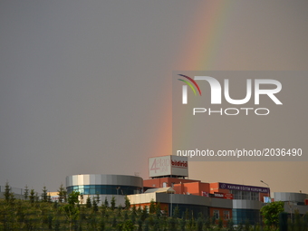 A rainbow is seen over the sky during rain in summer in Ankara, Turkey on June 21, 2017. (