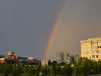 A rainbow divides the sky during rain in summer in Ankara, Turkey on June 21, 2017. (