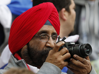 A fan takes a photo during the FIFA Confederations Cup Russia 2017 Group A match between Russia and Portugal at Spartak Stadium on June 21,...