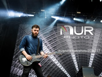 Justin Lockey of the english rock band Editors pictured on stage as they perform at Ippodromo San Siro in Milan, Italy on 21th June 2017. (