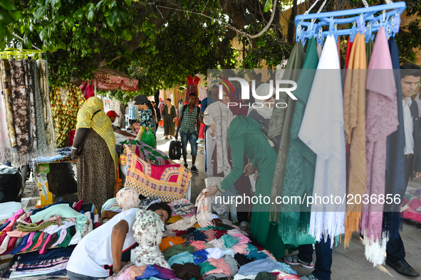 People seen on the street market making their purchases ahead of Laylat al-Qadr celebrations in Rabat, Morocco, on 21 June 2017.  
Laylat al...