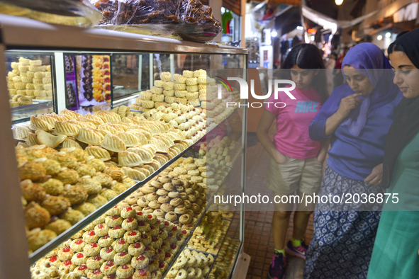 Ladies await to buy a pastry in a busy Rabat Medina main street after Iftar meal.  
Laylat al-Qadr, or Night of Destiny, which falls on the...
