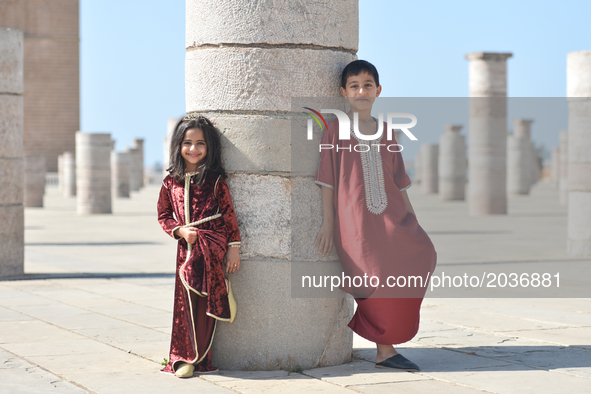 Jannat (age 5) and Anas (age 8) pose for a picture near the Hassan Tower in Rabat, Morocco, on 21 June 2017.  

While millions of Moroccans...