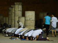 Moroccan worshipers pray during Laylat al-Qadr outside the Mausoleum of Mohammed V
in Rabat.  
Laylat al-Qadr, or Night of Destiny, which fa...