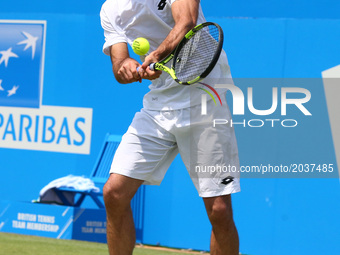 Viktor Troicki SRB ageinst Donald Young (USA) during Round Two match on the third day of the ATP Aegon Championships at the Queen's Club in...