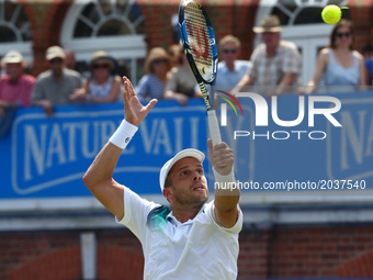 Gilles Muller LUX against Jo-Wilfried Tsonga FRA during Round Two match on the third day of the ATP Aegon Championships at the Queen's Club...