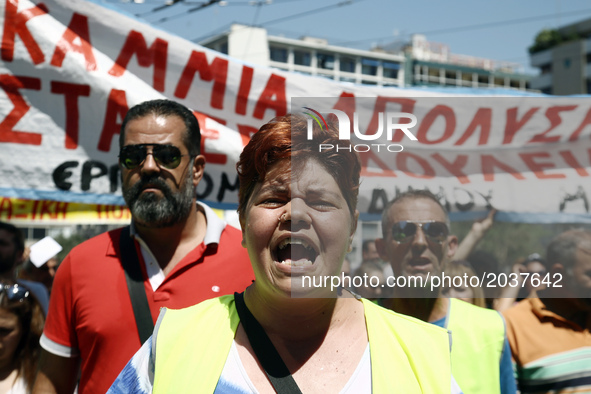 Municipal workers march in central Athens on June 22, 2017. The Federation of workers in municipalities is holding a 24-hour strike and orga...