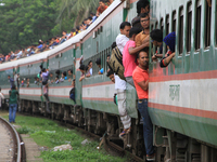 Bangladeshi travelers are ride on an over-crowded to go home to celebrate Eid-ul-Fitr holyday with their family in Dhaka, Bangladesh on June...
