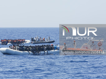 LAMPEDUSA, ITALY - MAY 19: Refugees and migrants wait in a small rubber boat to be rescued by the Italian Cost Guard on May 19, 2017 in inte...