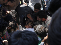 relatives wail near the body of Tauseef Ahmed,A civilian during his funeral  in Tengpun, (25 miles) south of Srinagar, Indian Administrated...