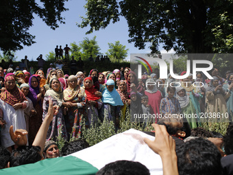Villagers carry the body of Tauseef Ahmed,A civilian during his funeral  in Tengpun, (25 miles) south of Srinagar, Indian Administrated  Kas...
