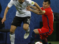Jonas Hector (L) of Germany national team and Gary Medel of Chile national team vie for the ball during the Group B - FIFA Confederations Cu...