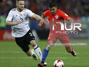Shkodran Mustafi (L) of Germany national team and Alexis Sanchez of Chile national team vie for the ball during the Group B - FIFA Confedera...