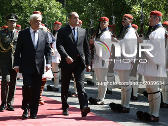 Greek President Prokopis Pavlopoulos and Boulgarian President Rumen Radev (R)  inspect the Presidential guard durind the official reception...