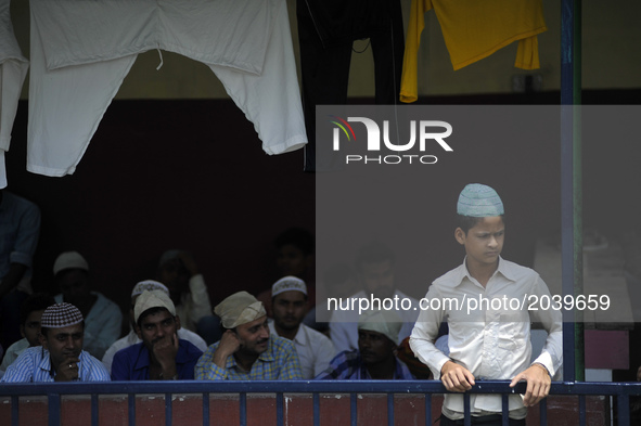 A Nepalese Muslim youth glancing before offering last Friday of Ramadan's Ritual Prayer at Nepali Jame mosque at Kathmandu, Nepal on Friday,...