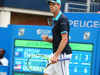 John Thompson (AUS) against Sam Querrey (USA) during Men's Singles Round Two match on the fourth day of the ATP Aegon Championships at the Q...