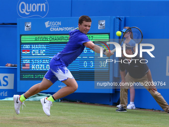 Stefan Kozlov (USA) against Marin Cilic CRO during Men's Singles Round Two match on the fourth day of the ATP Aegon Championships at the Que...