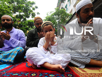 Indian Muslims offer prayers on the last congregational Friday of the holy month of Ramadan, following the Muslim Festival Eid al-Fitr ,the...