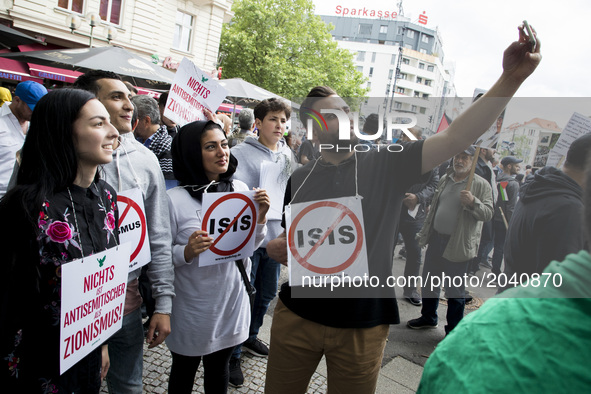 People attend an Al-Quds Demonstration in Berlin, Germany on June 23, 2016.  