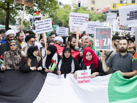 People carries a huge Palestinin flag during an Al-Quds Demonstration in Berlin, Germany on June 23, 2016.  (