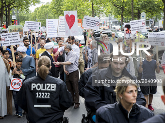 People attend an Al-Quds Demonstration in Berlin, Germany on June 23, 2016.  (