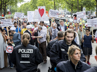 People attend an Al-Quds Demonstration in Berlin, Germany on June 23, 2016.  (