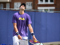 John Isner of the US practices at The Queen's Club, London on June 22, 2017. The players use the grass courts to train themselves before the...