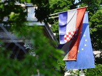 A Croatian national flag and Europe flag are seen in Zagreb, Croatia on 24 June 2017. (