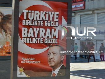 The ruling Justice and Development Party (AKP) posts a new billboard with the portrait of Turkish President Recep Tayyip Erdogan on the eve...