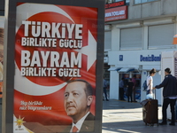 The ruling Justice and Development Party (AKP) posts a new billboard with the portrait of Turkish President Recep Tayyip Erdogan on the eve...